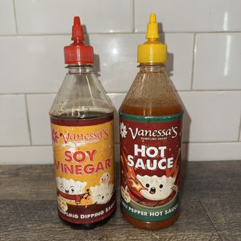 Vanessa's Dumpling House - Vanessa's Tables Have Their Soy Vinegar and Hot Sauce as Condiments - Chinese Near Me - New York, New York