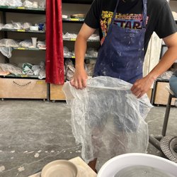 KC Clay Guild - Covering up our piece to dry on the shelves before trimming and bisque firing