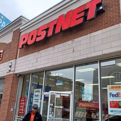 Outside in the front of the store