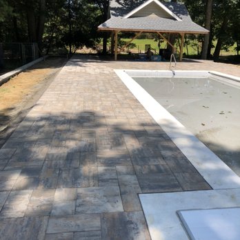 CRA Site Development - Retaining wall and pavers installed around pool in Tinton Falls. - General Contractors Near Me - Manasquan, New Jersey