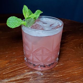 Anchor Spa - a pink drink in a glass on a wooden table - Cocktail Bars Near Me - New Haven, Connecticut Anchor Spa - a pink drink in a glass on a wooden table - Cocktail Bars Near Me - New Haven, Connecticut