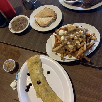 Chez Vachon - A sample of French Canadian fare: blueberry crêpe, maple product, toast with hot gorton, poutine, and tourtier with baked beans and gravy. - Breakfast & Brunch Near Me - Manchester, New Hampshire