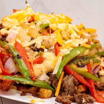 Shay's Wave - a plate of food on a table - Food Trucks Near Me Shay's Wave - a plate of food on a table - Food Trucks Near Me