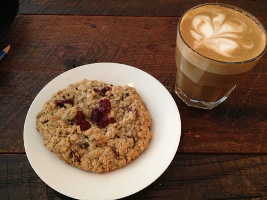 Photo of Kitsuné - Montreal, QC, CA. Un latte au soya avec une galette maison aux canneberges