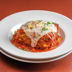 Sarina's Italian Kitchen - Sarina's Lasagna
Layers of Italian lasagna noodles, ground beef, Italian sausage, mozzarella and cream cheese with Italian spices.