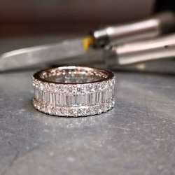 Carolyn Codd Jewellery - Hand forged Platinum eternity ring with fine baguette cut and round diamonds. Hand crafted in wrought Platinum in our on-site workshop.