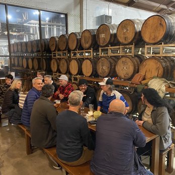 Fieldwork Brewing Co. - Sitting next to a wall of kegs (Kona the puppy in the background) - Breweries Near Me - Berkeley, California Fieldwork Brewing Co. - Sitting next to a wall of kegs (Kona the puppy in the background) - Breweries Near Me - Berkeley, California
