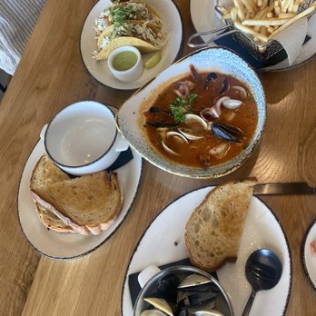 Pacific Coast Fish - Table of four with Chef's Stew, Clams and Mussels, Crab Roll, and Fish Tacos! - Seafood Near Me - Seal Beach, California Pacific Coast Fish - Table of four with Chef's Stew, Clams and Mussels, Crab Roll, and Fish Tacos! - Seafood Near Me - Seal Beach, California