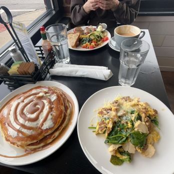 Sleepy Bee Cafe - Oakley - Buttermilk Cinnamon pancakes and Scrambled eggs with chicken, goetta, spinach, and cheese. - Breakfast & Brunch Near Me - Cincinnati, Ohio Sleepy Bee Cafe - Oakley - Buttermilk Cinnamon pancakes and Scrambled eggs with chicken, goetta, spinach, and cheese. - Breakfast & Brunch Near Me - Cincinnati, Ohio