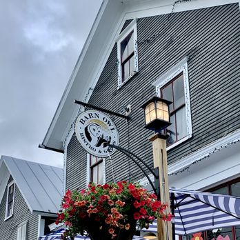 Barn Owl Bistro and Goods - Our store in the spring, summer and fall has a charming porch complete with fountains. - Candy Stores Near Me - Enosburg Falls, Vermont Barn Owl Bistro and Goods - Our store in the spring, summer and fall has a charming porch complete with fountains. - Candy Stores Near Me - Enosburg Falls, Vermont
