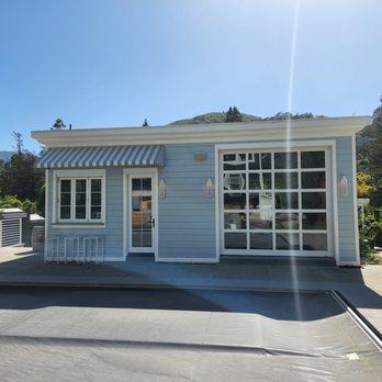 Ceres Construction - a blue house with a white awning - General Contractors Near Me