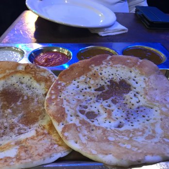 Anjappar Chettinad Restaurants - two pancakes on a plate - Indian Near Me - Brampton, Ontario Anjappar Chettinad Restaurants - two pancakes on a plate - Indian Near Me - Brampton, Ontario