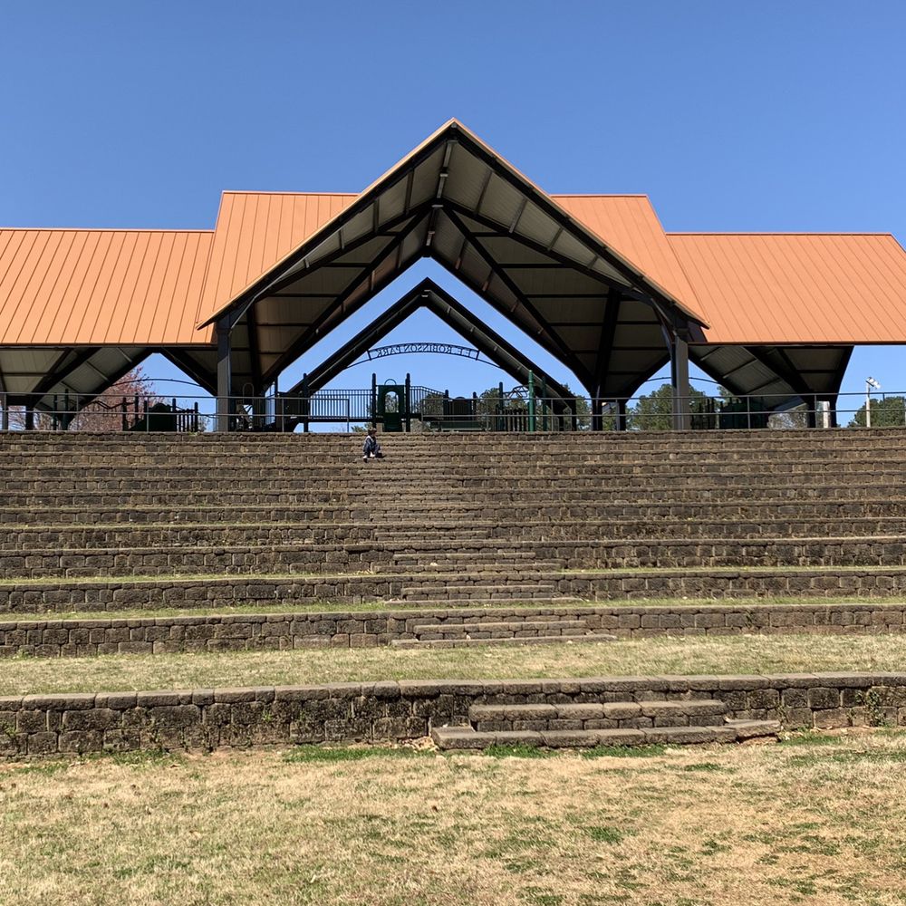 Amphitheater behind covered playground