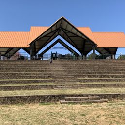 Amphitheater behind covered playground