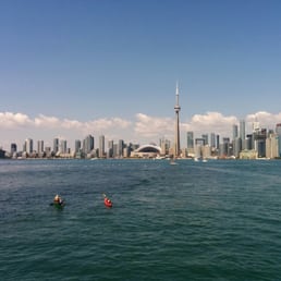 Picture of toronto from the ferry with some little canoers