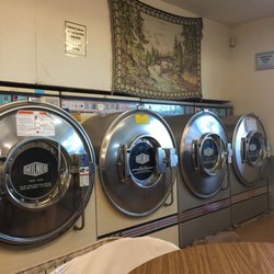 Lakeland Square Laundry - Big front load washers. Clean but the old lady that works here is a miserable hag!!!!