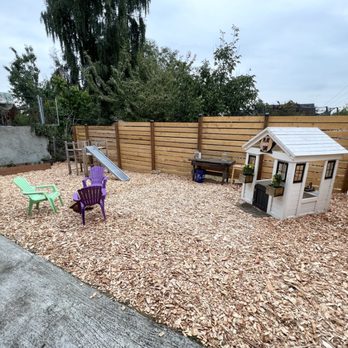 Tiny Cabin Montessori - Play Yard with cedar chips, edible garden, playhouse, and mud kitchen. - Preschools Near Me - Seattle, Washington