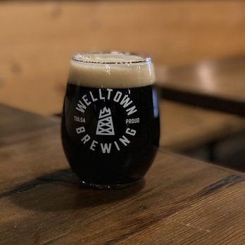 Welltown Brewing - a glass of beer on a table - Breweries Near Me - Tulsa, Oklahoma