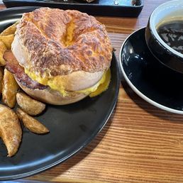 Breakfast bagel and Cafe Americano Breakfast bagel and Cafe Americano