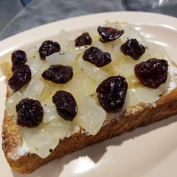 The Portico Cafe - Breakfast toast, with goat cheese, caramelized onions, dried cherries, sea salt...sounds good but tastes off - Coffee & Tea Near Me - Tampa, Florida