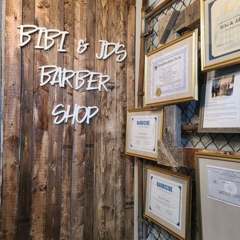 Bibi & JD's Barbershop - Back wall where all their permits are and waiting area. Super cool - Barbers Near Me - Woodside, New York Bibi & JD's Barbershop - Back wall where all their permits are and waiting area. Super cool - Barbers Near Me - Woodside, New York