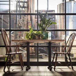 Watershed Kitchen & Bar - Tables with a view into the distillery production space!