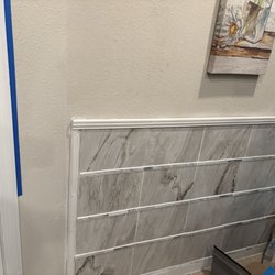 Jacksonville Handy Man 911 - Side wall tiled with trim added.