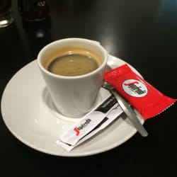 Trattoria Milano - Double espresso - a little burnt unfortunately... but there is a biscuit :)