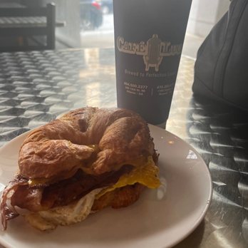 Cafe Lucia - Bacon egg cheese or croissant hot  coffee with sweet cream yum - Coffee & Tea Near Me - Atlanta, Georgia