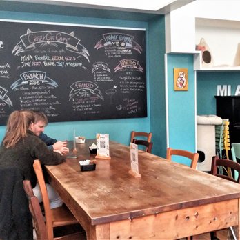 Crazy Cat Café - This is the interior closer to the windows and the menu board does indicate a brunch et. al. - Cafes Near Me - Milan, Michigan