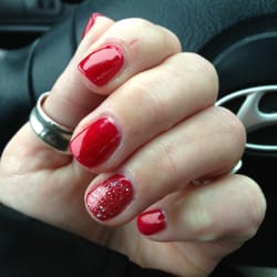 Amy's Nails & Spa - Gelish polish! I got #29 for the holidays & a super sparkly silver added to my ring finger. Great idea they had!