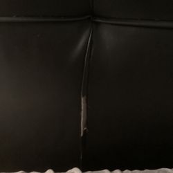 Rooms To Go - Rip in head board.