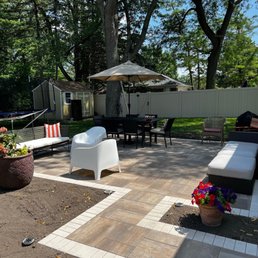 a patio with white furniture