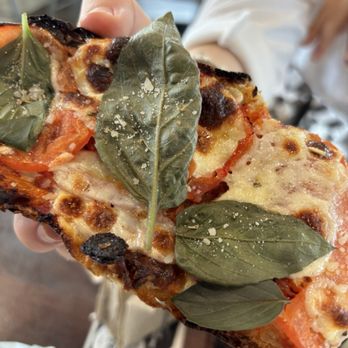 Salty Bread Pizza Cafe - Burned Margherita French bread. - Pizza Near Me - Irondequoit, New York Salty Bread Pizza Cafe - Burned Margherita French bread. - Pizza Near Me - Irondequoit, New York