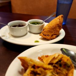 Samosas are delicious! Can't wait for the rest of the food.