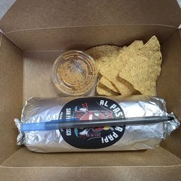 Shrimp burrito to go. Notice the scant pieces of chip that's included. Shrimp burrito to go. Notice the scant pieces of chip that's included.