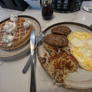 Eggcited Brunch House - Waffles, whipped cream, two sausages, harsh brown, and overheard egg, extra crispy extra done. - Breakfast & Brunch Near Me - McKinney, Texas