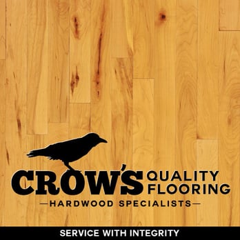 Crow's Quality Flooring - a black bird on a wood floor - Flooring Near Me Crow's Quality Flooring - a black bird on a wood floor - Flooring Near Me