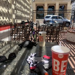 Outdoor seating w tables set far apart for social distancing.