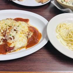 Tuscany NY Italian Restaurant & Pizzeria - Chicken Parmesan and fettuccine Alfredo