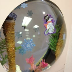 Daniel Ponce, DDS - A big fish tank in the shape of a globe.