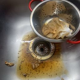 Nasty tasting hot-and-sour soup going down the drain