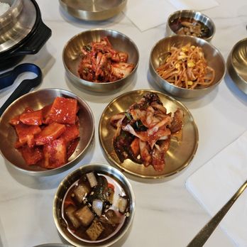 Hanmaru Korean Cuisine - Banchan (all spicy with the marinated raw crab on the flat plate) - Korean Near Me - Milpitas, California