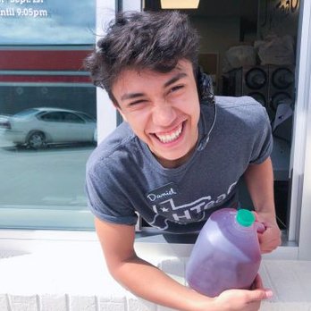HTeaO - a young man holding a purple bottle - Coffee & Tea Near Me - Longview, Texas