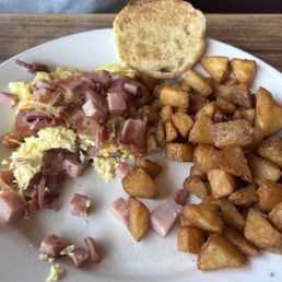 Ham, bacon and cheddar omelette with house potatoes
