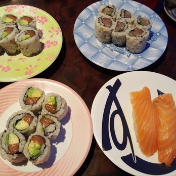 Gorilla Sushi Diversey - Salmon avocado rolls on the left, hamachi roll upper right, salmon nigiri lower right - Sushi Bars Near Me - Chicago, Illinois Gorilla Sushi Diversey - Salmon avocado rolls on the left, hamachi roll upper right, salmon nigiri lower right - Sushi Bars Near Me - Chicago, Illinois