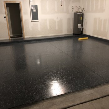 Apex Flooring - a room with a black floor - Flooring Near Me Apex Flooring - a room with a black floor - Flooring Near Me