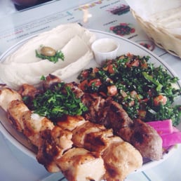 Chicken and Lamb grill with hummus, tabouli and pita. Chicken and Lamb grill with hummus, tabouli and pita.