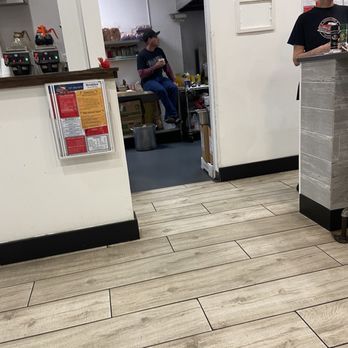 Seminole Diner - Cook sitting on the counter in kitchen right next to food prep area‼ - Breakfast & Brunch Near Me - Seminole, Florida