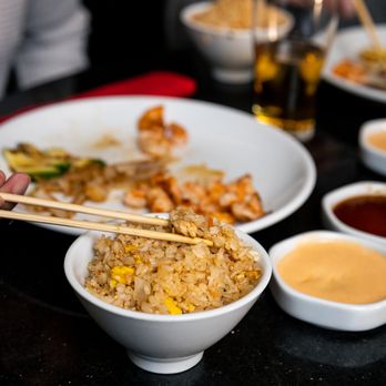 Benihana - Alpharetta - a bowl of fried rice with chopsticks - Steakhouses Near Me - Alpharetta, Georgia Benihana - Alpharetta - a bowl of fried rice with chopsticks - Steakhouses Near Me - Alpharetta, Georgia